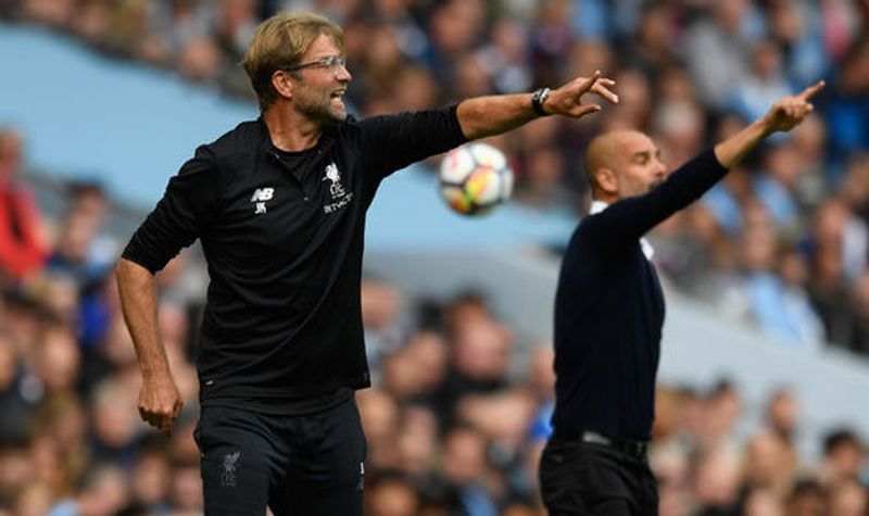 juergen klopp dan Pep Guardiola (express co uk)