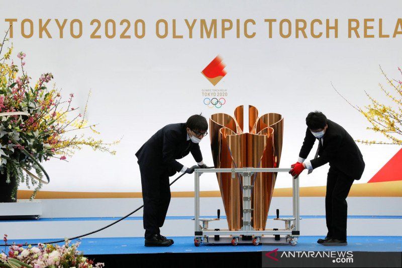 2021-03-25T001226Z_1332022415_RC20IM9MVG1Y_RTRMADP_3_OLYMPICS-2020-RELAY