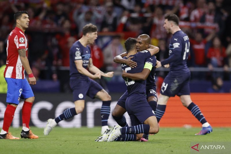 2022-04-13T210343Z_1462862288_UP1EI4D1MI5R5_RTRMADP_3_SOCCER-CHAMPIONS-ATM-MCI-R