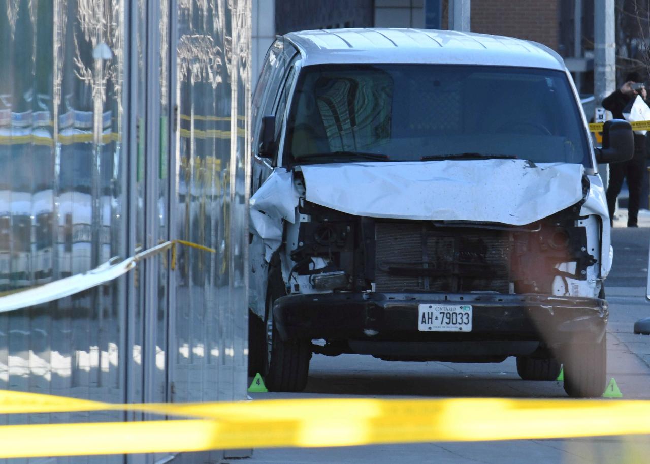 A damaged van seized by police is seen after multiple people were struck at a major intersection northern Toronto