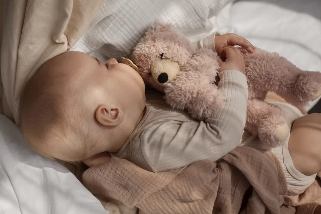 top-view-cute-baby-with-stuffed-animal (2)